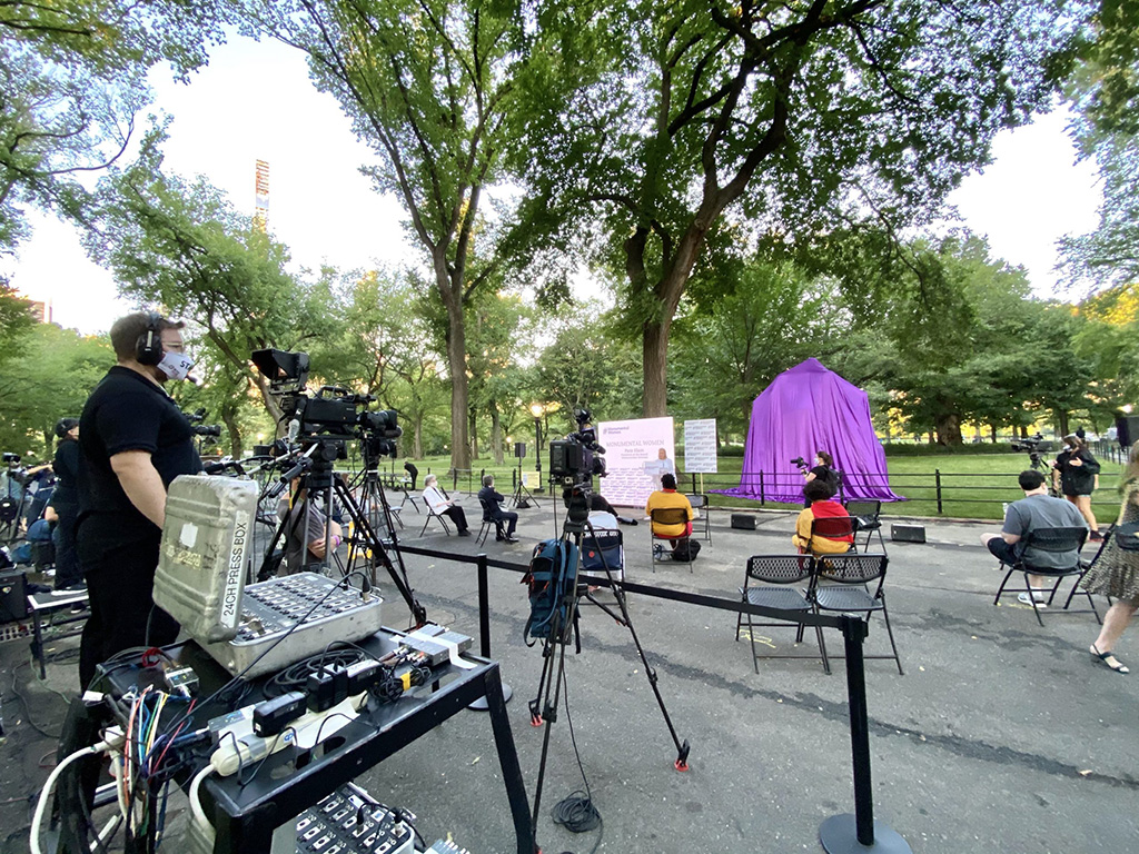 Central park event unveiling of statue of Monumental Women event production with event production crew behind