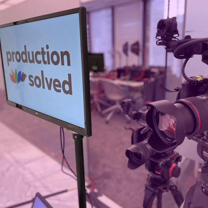 camera and a Monitor showing event production solved logo during a nonprofit event